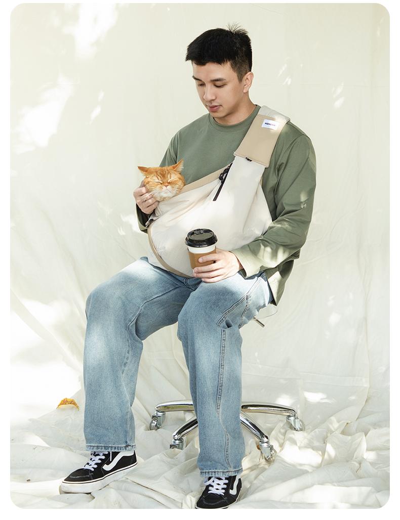 HD020016 Pet Travel Sling Tote real-life photo with a cat outdoors