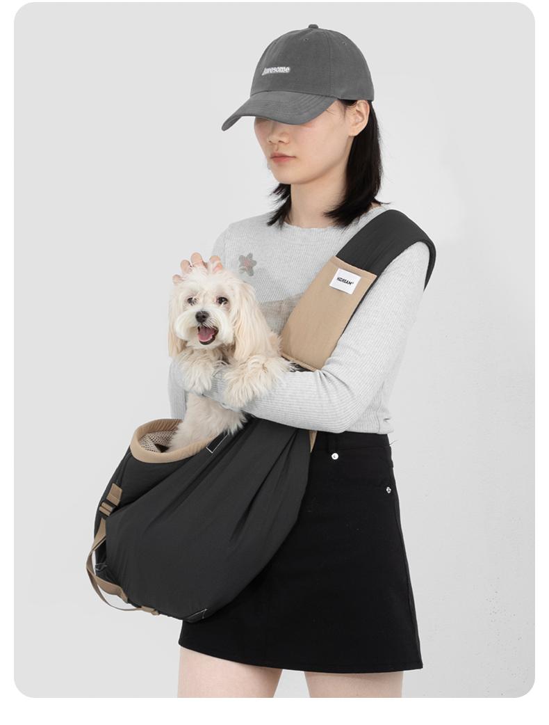 HD020016 Pet Travel Sling Tote real-life photo carrying a small dog