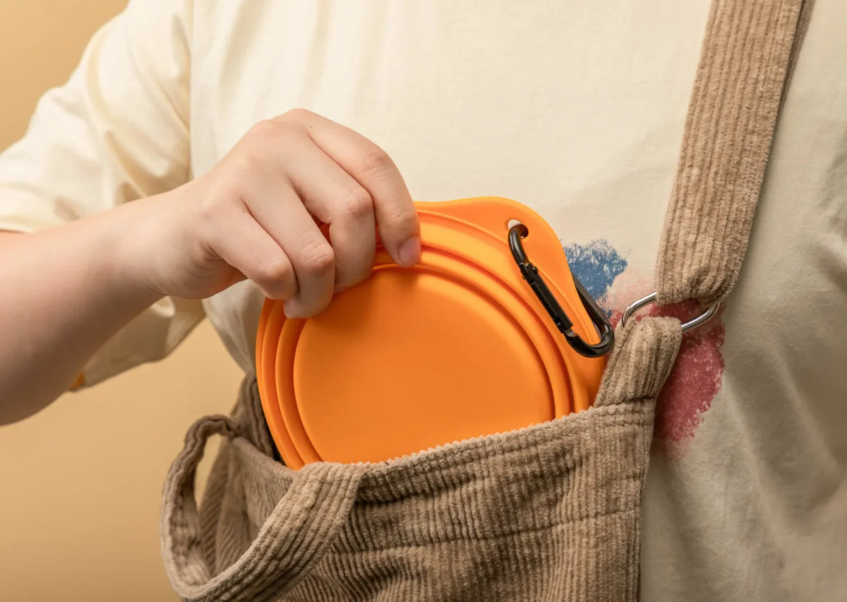 Foldable silicone travel bowl stored in a travel bag